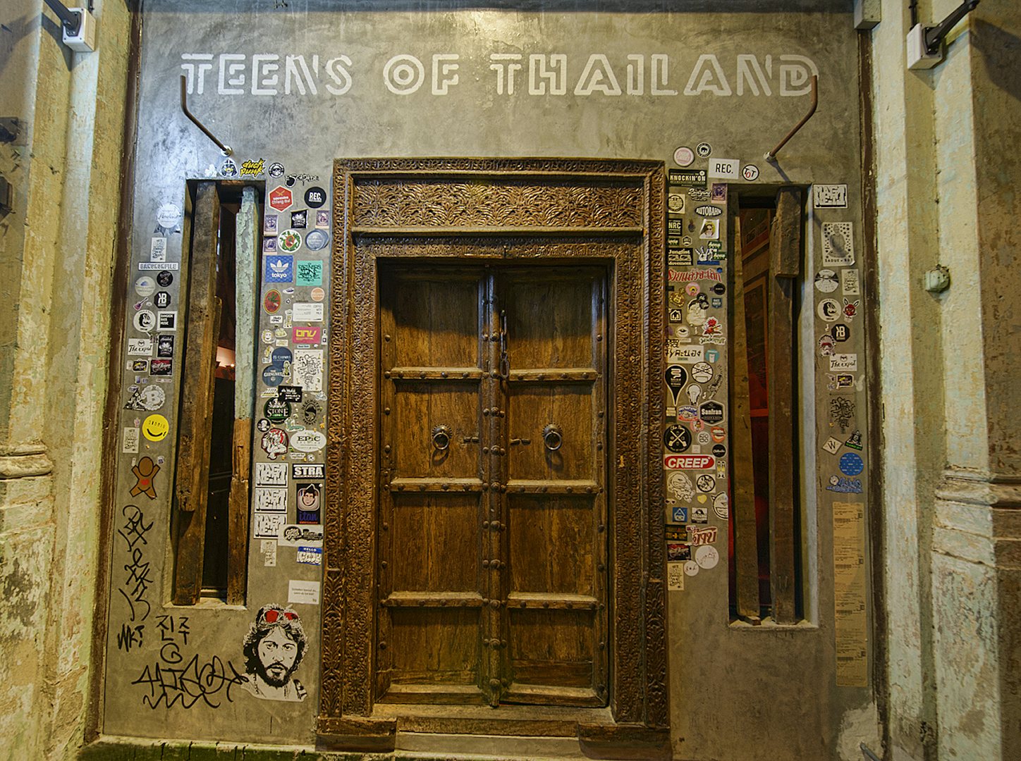 old wooden entrance door at Teens of Thailand bar