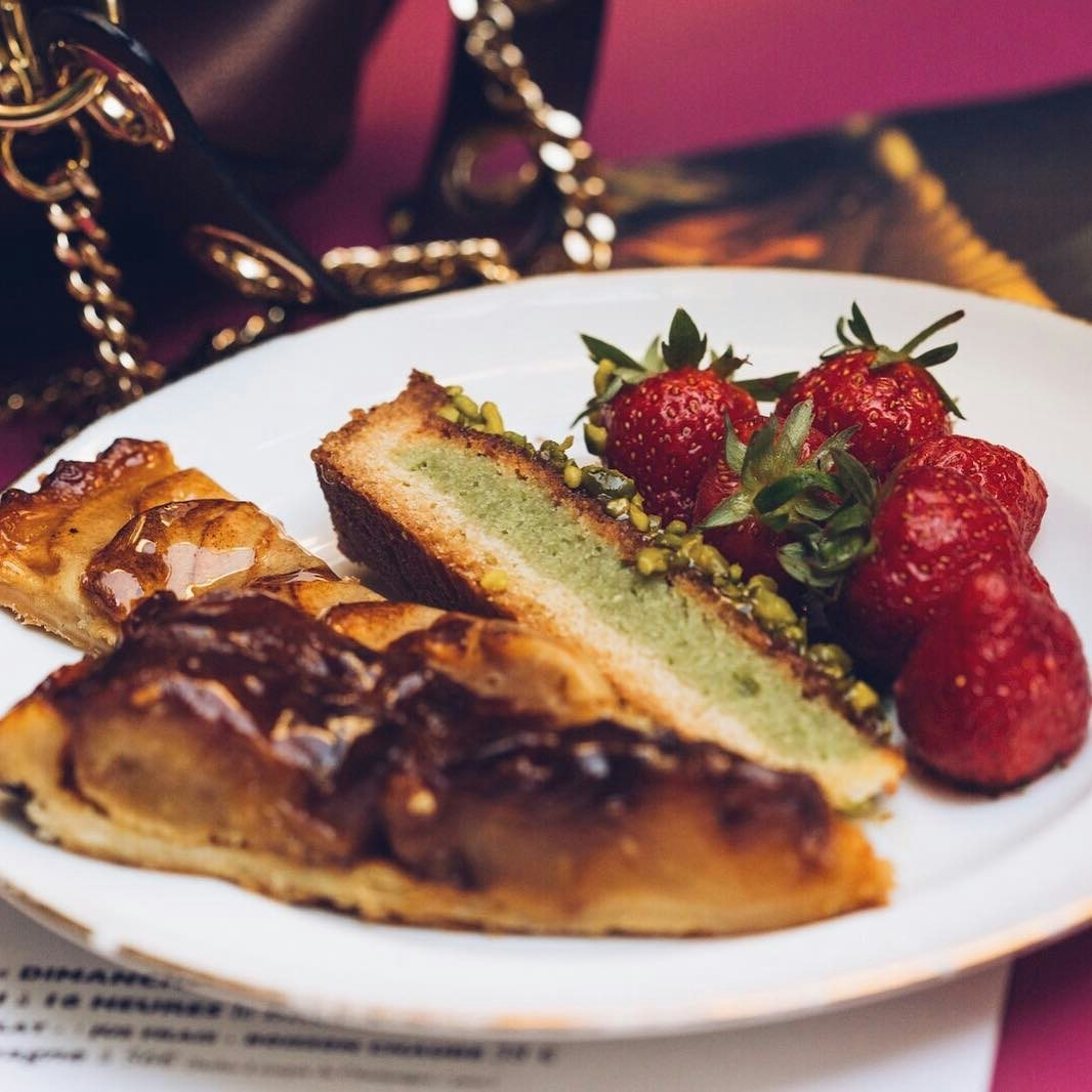 slices of cake and strawberries on a plate