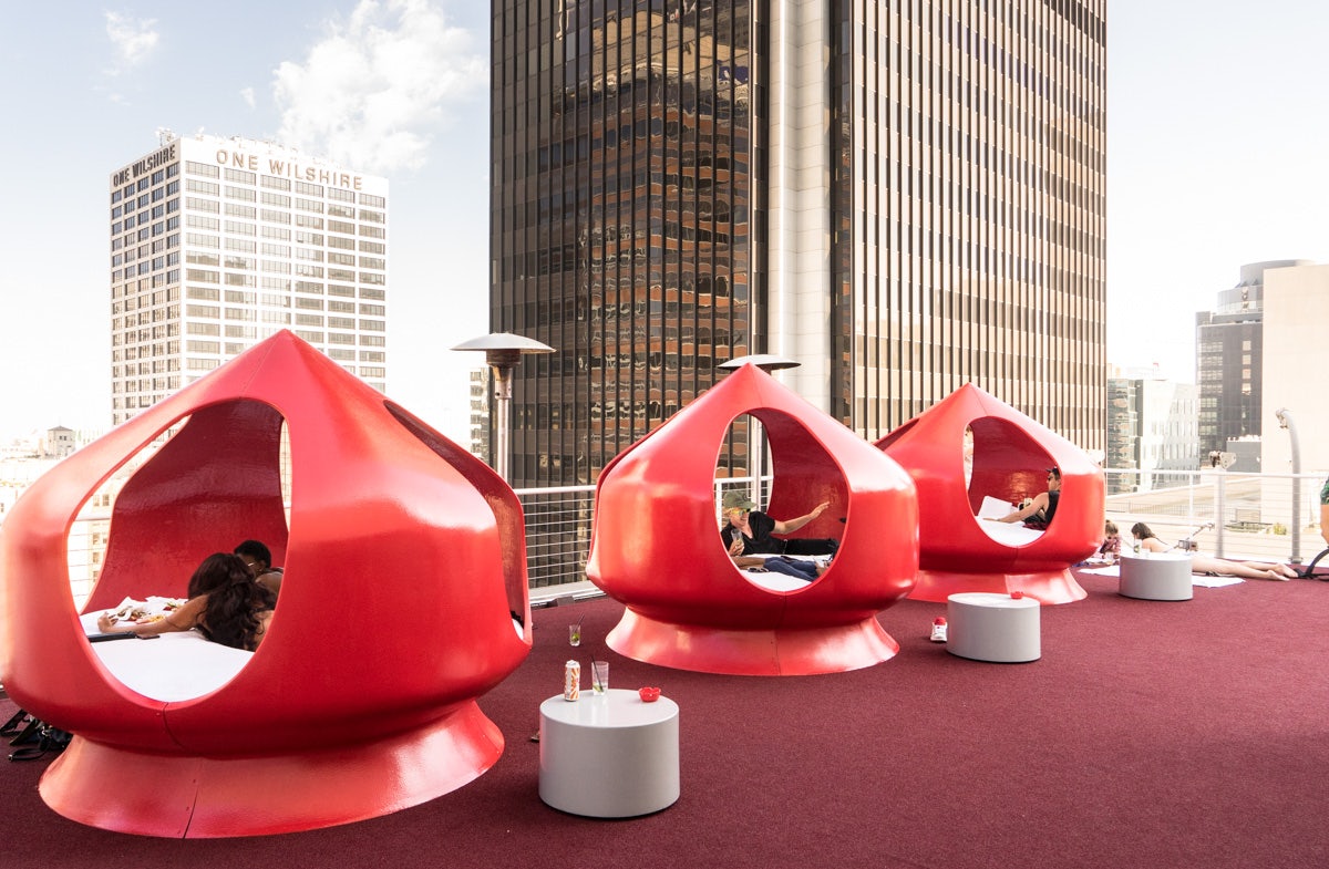 red lounging pods at the Rooftop of the Standard Hotel LA