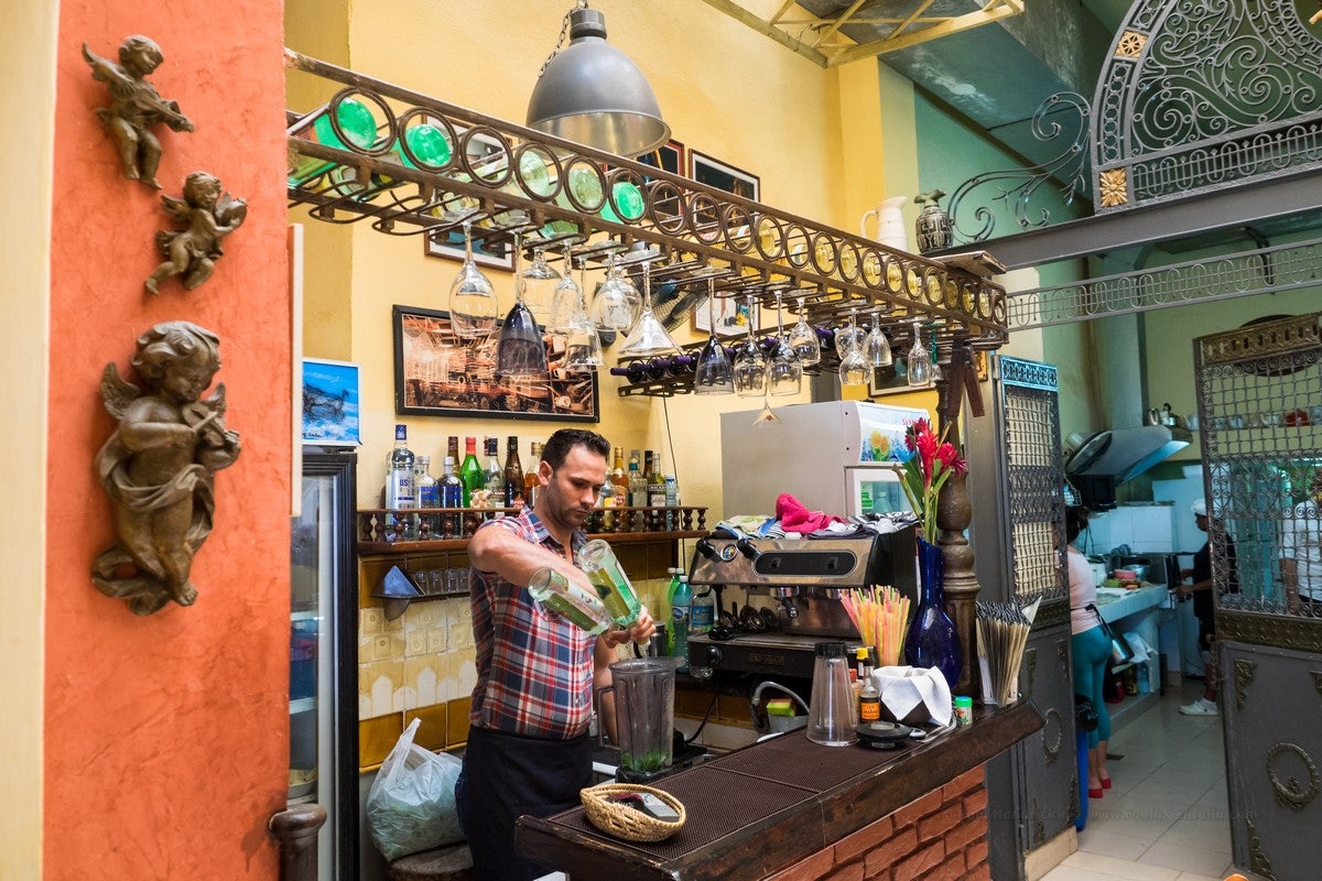 a man making cocktails at Dona Eutimia Havana