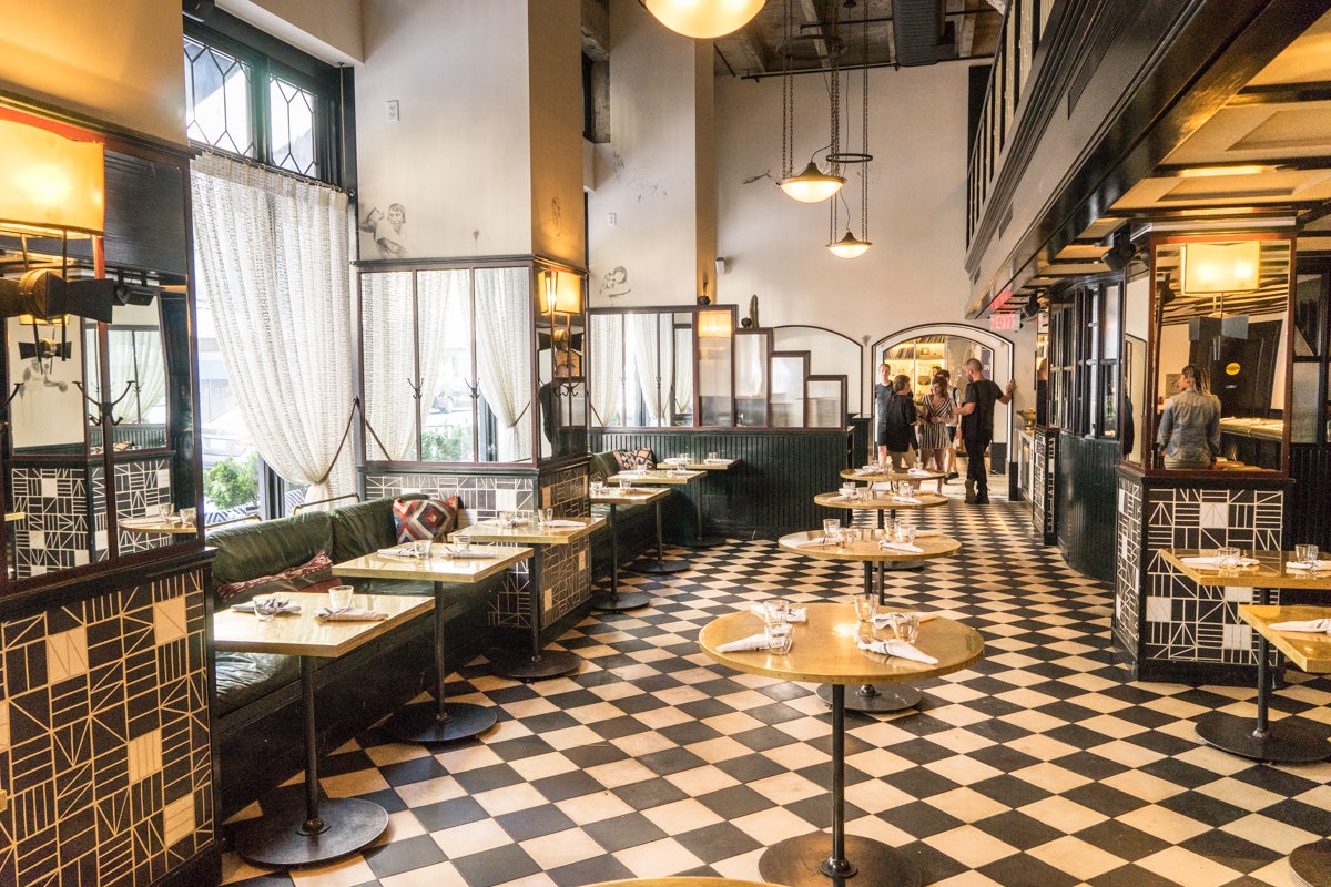 bar interior with black and white squared tiles at the Ace Hotel