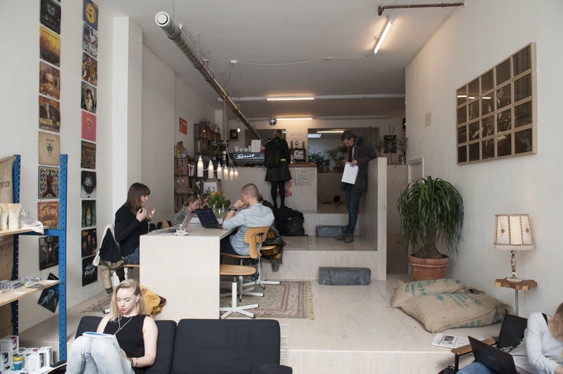 people drinking at coffee bar White Label coffee in