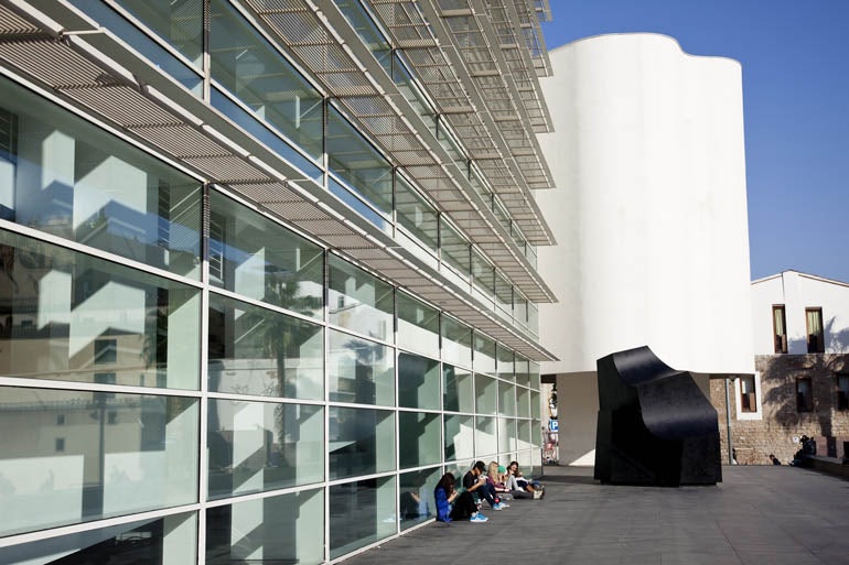 people sitting outside at MACBA