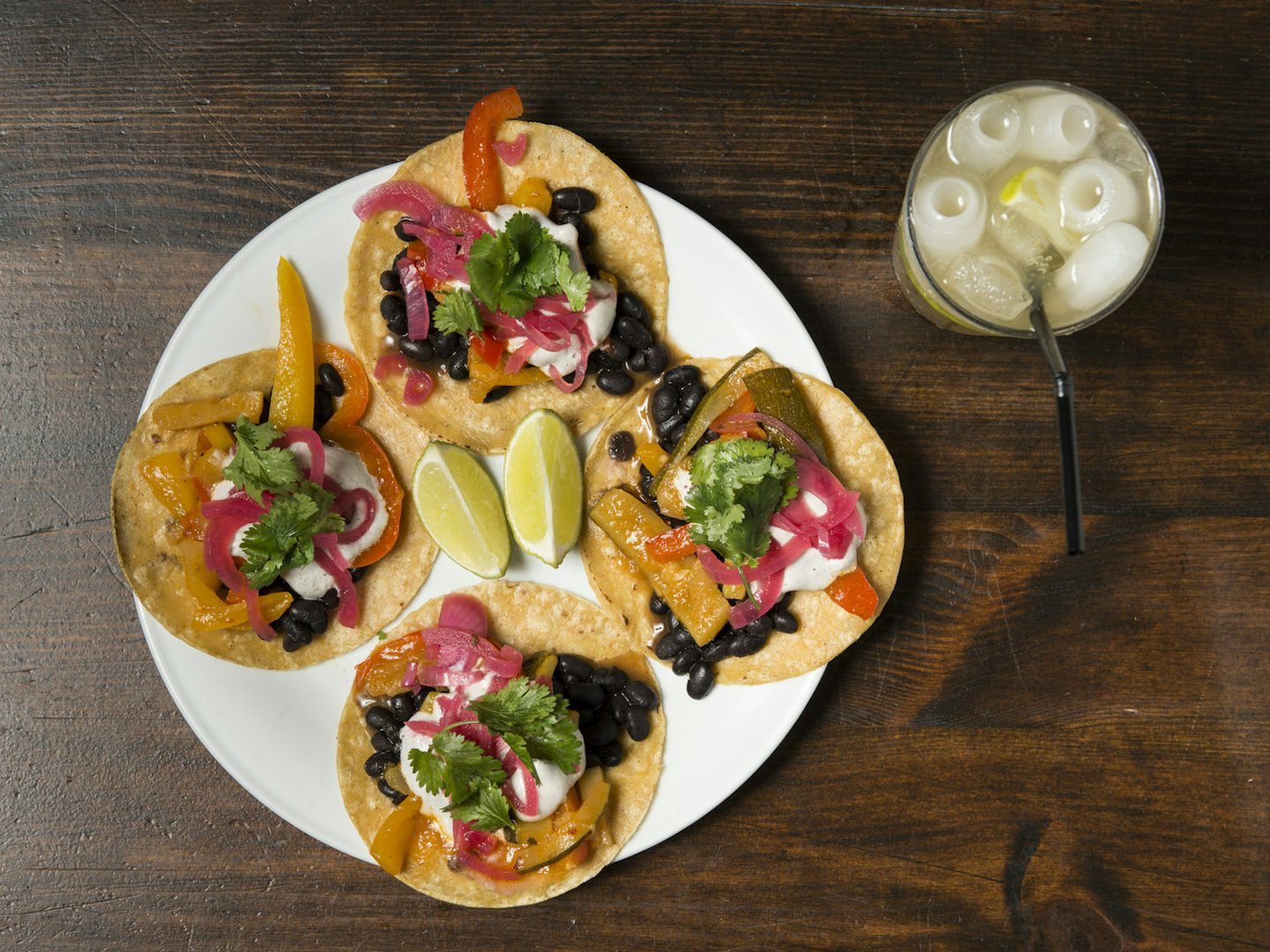a plate with four tacos and lemonade from Burrito Baby Berlin