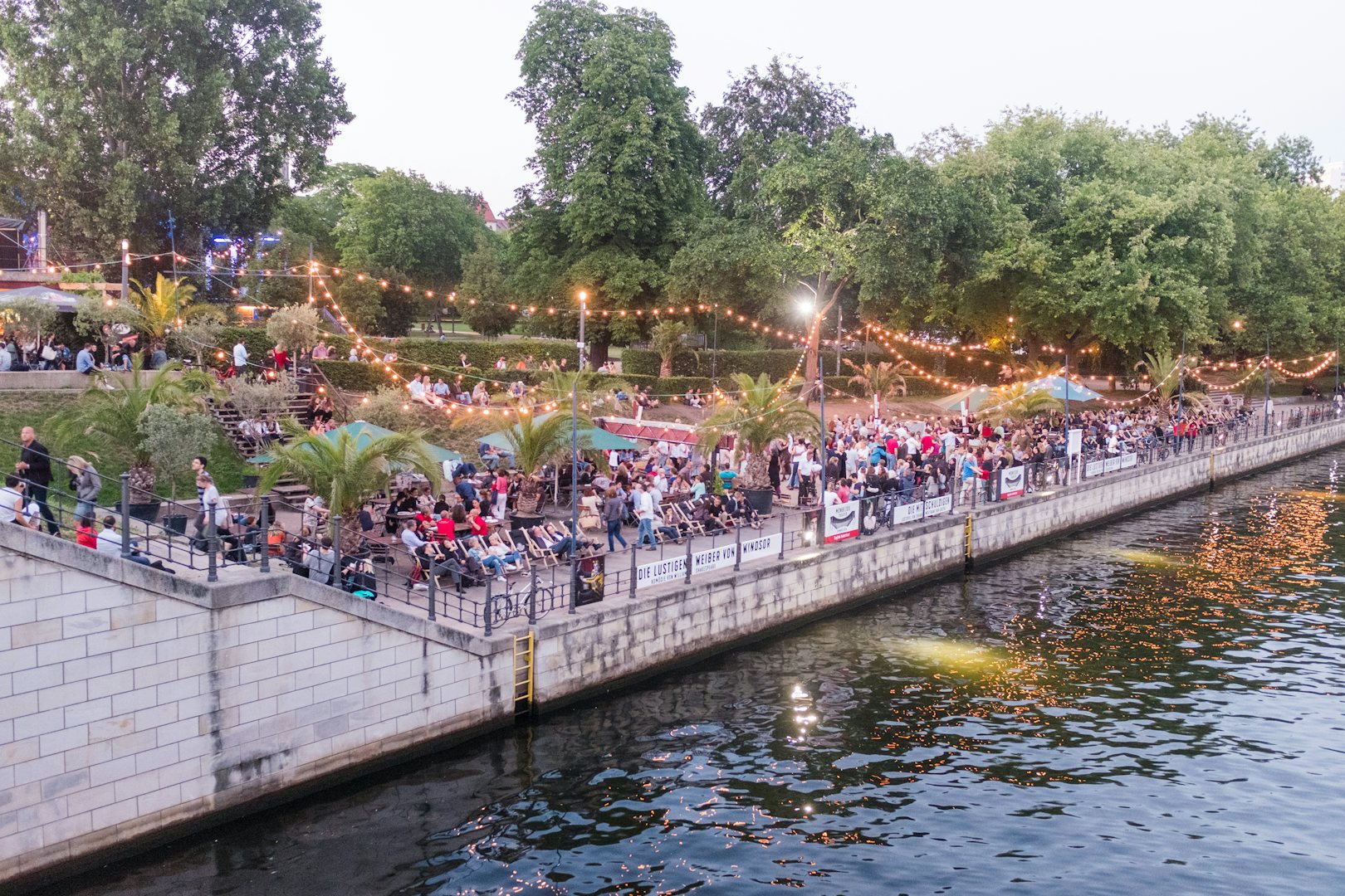 people by the water at Strandbar Mitte