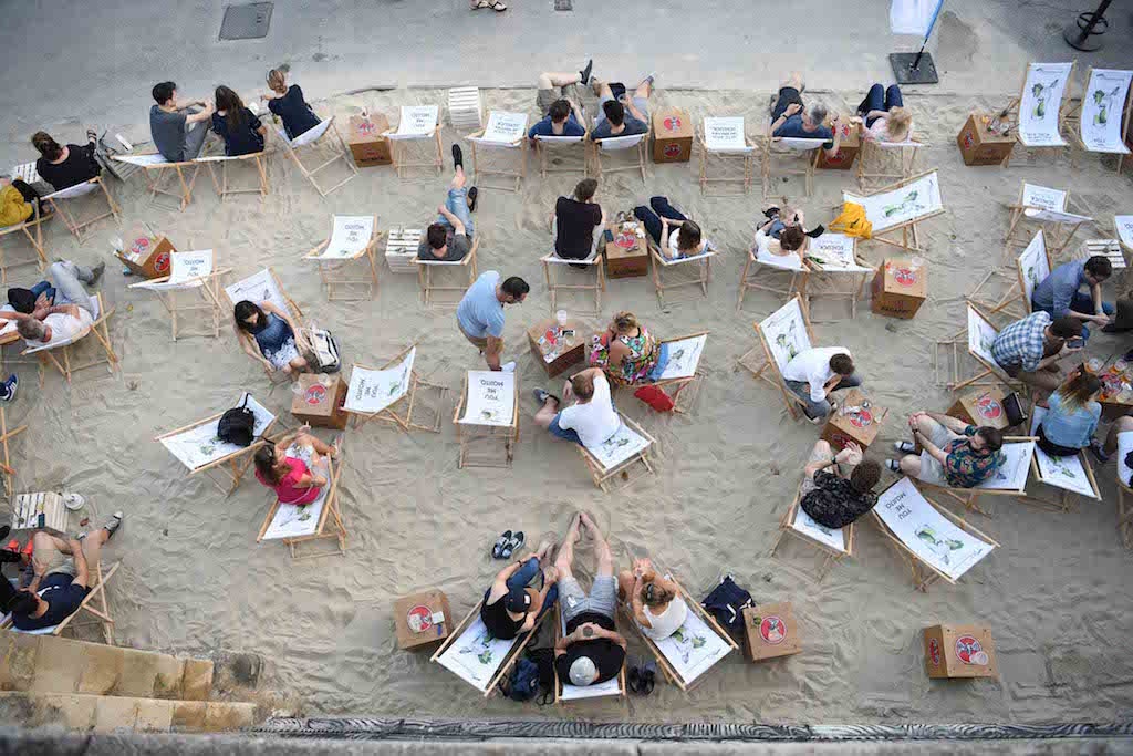 people in lounge chairs at the beach at Adria Vienna