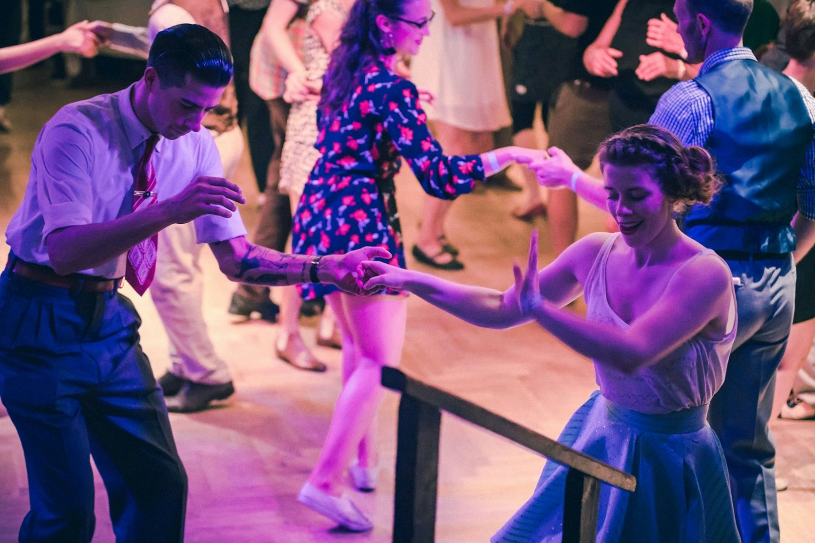 a couple dancing the Lindy Hop at Some like it Hot Ballroom