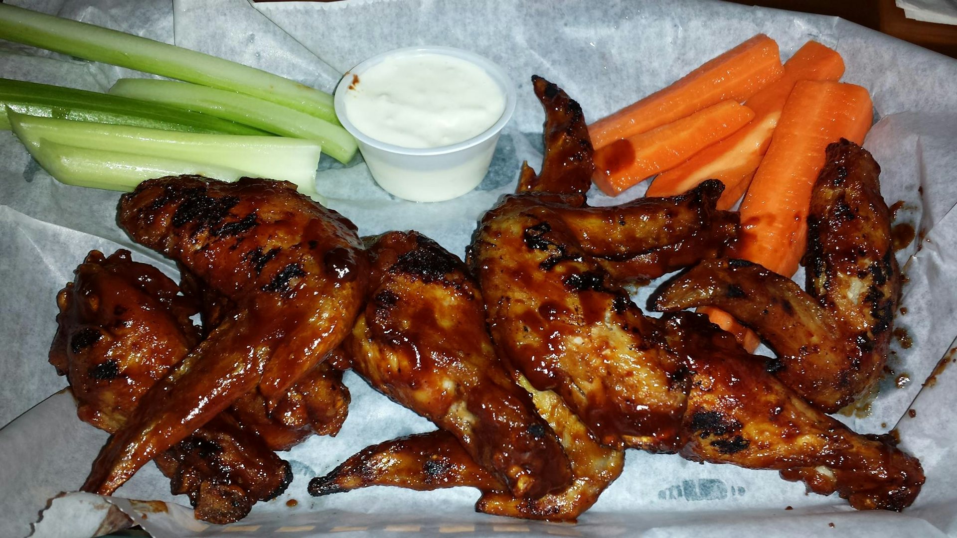 grilled chicken wings and vegetables at Corbett's Sports Bar & Grill