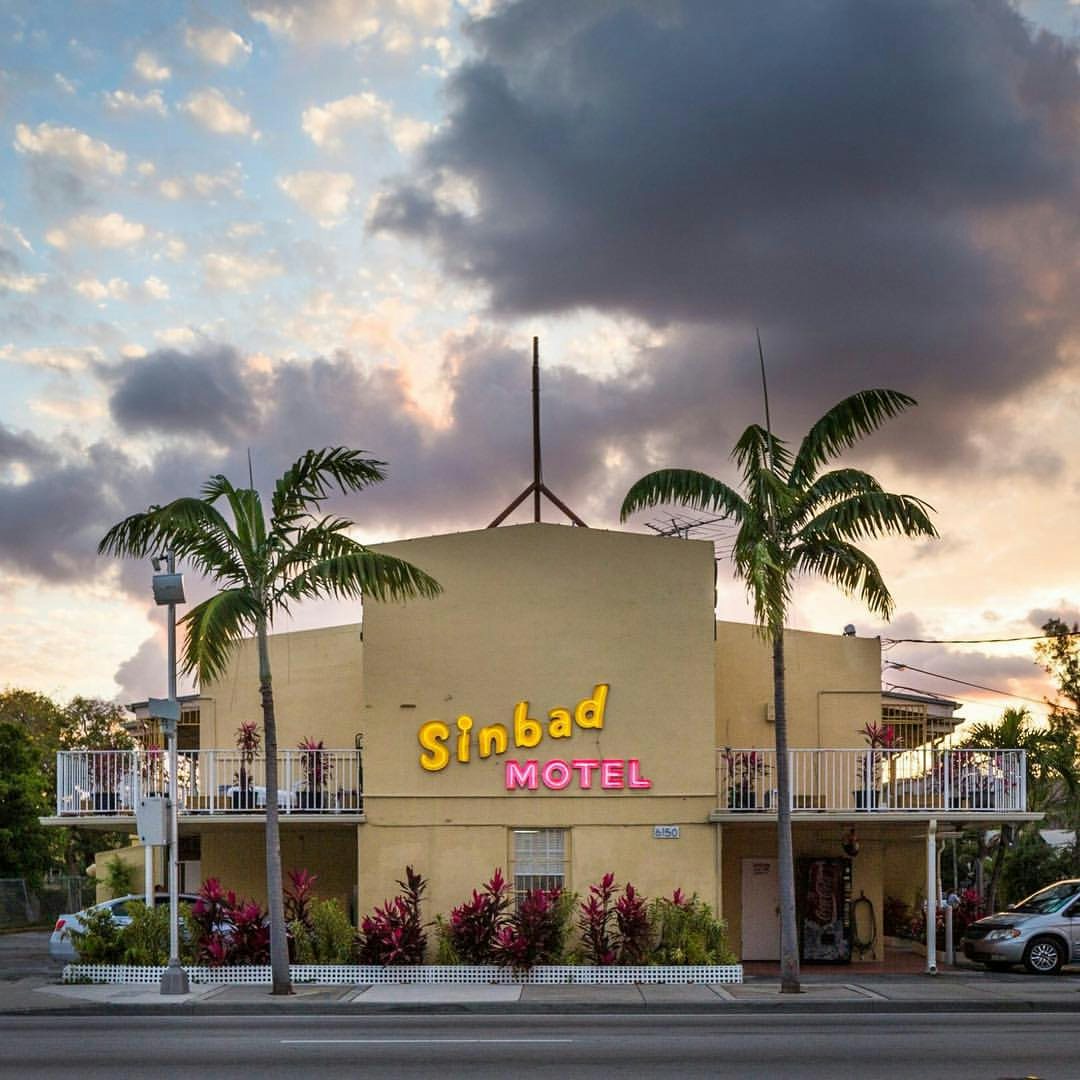 the Sinbad Motel against a sunset sky