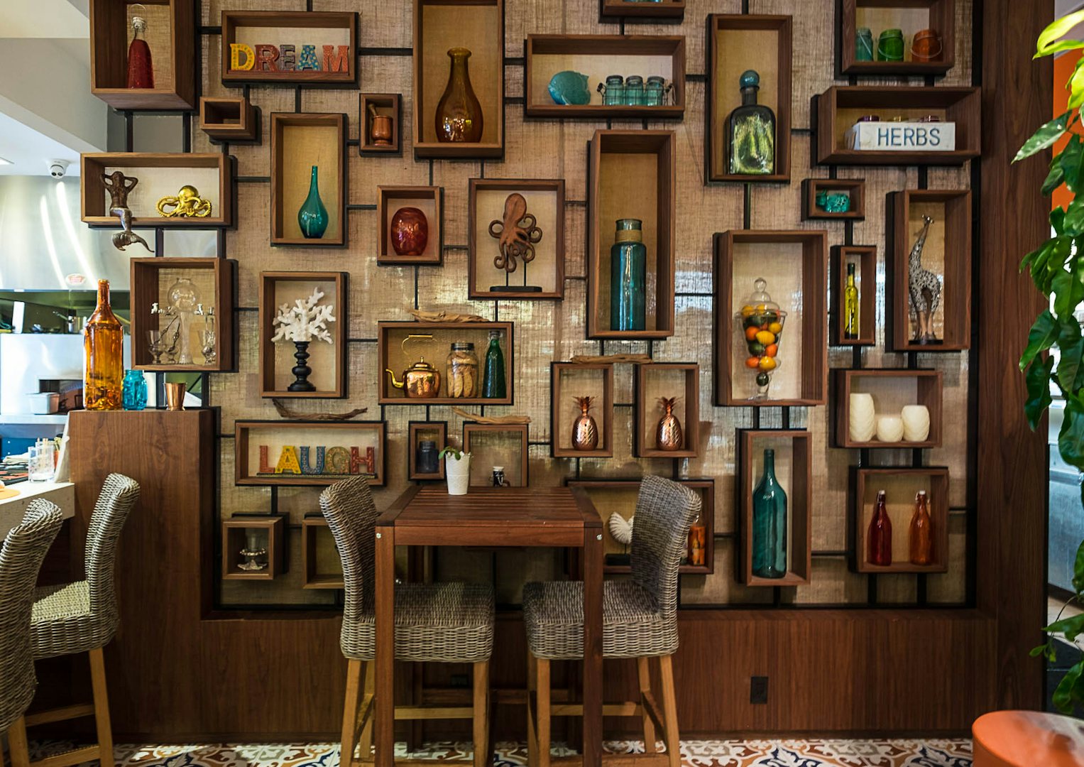 a decorative wall full of ceramics at Zest restaurant Miami