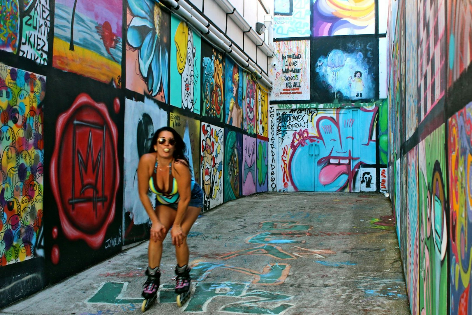 street graffiti and a woman skating at the Good Wall