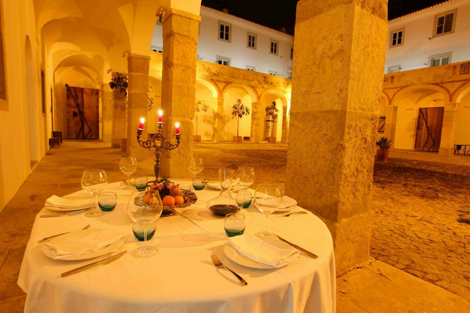 a set table at A Travessa's courtyard in Lisbon