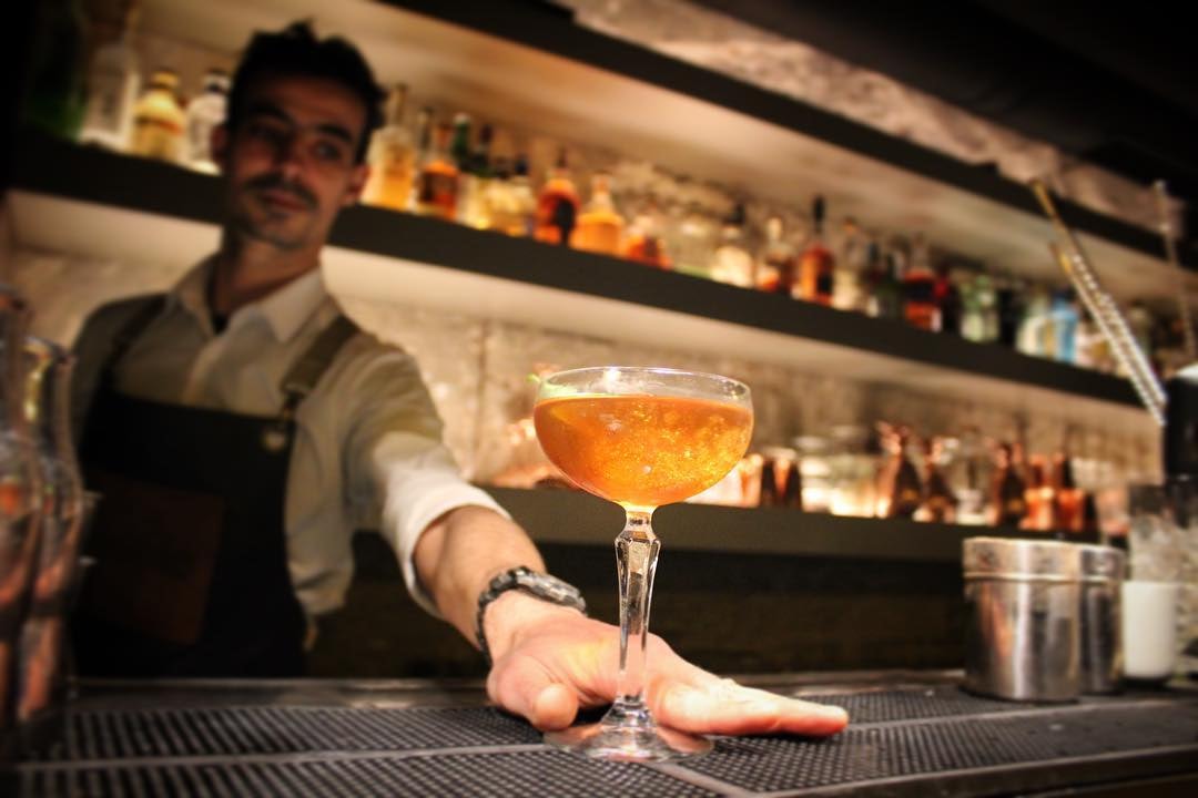 Bartender serving a cocktail at Double9