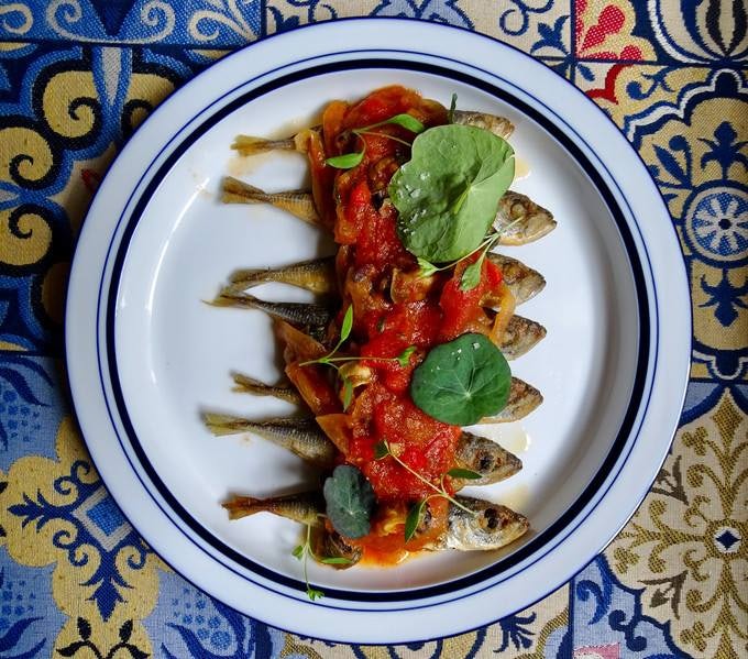 a dish with dried fish and tomato sauce from Casa de Pasto