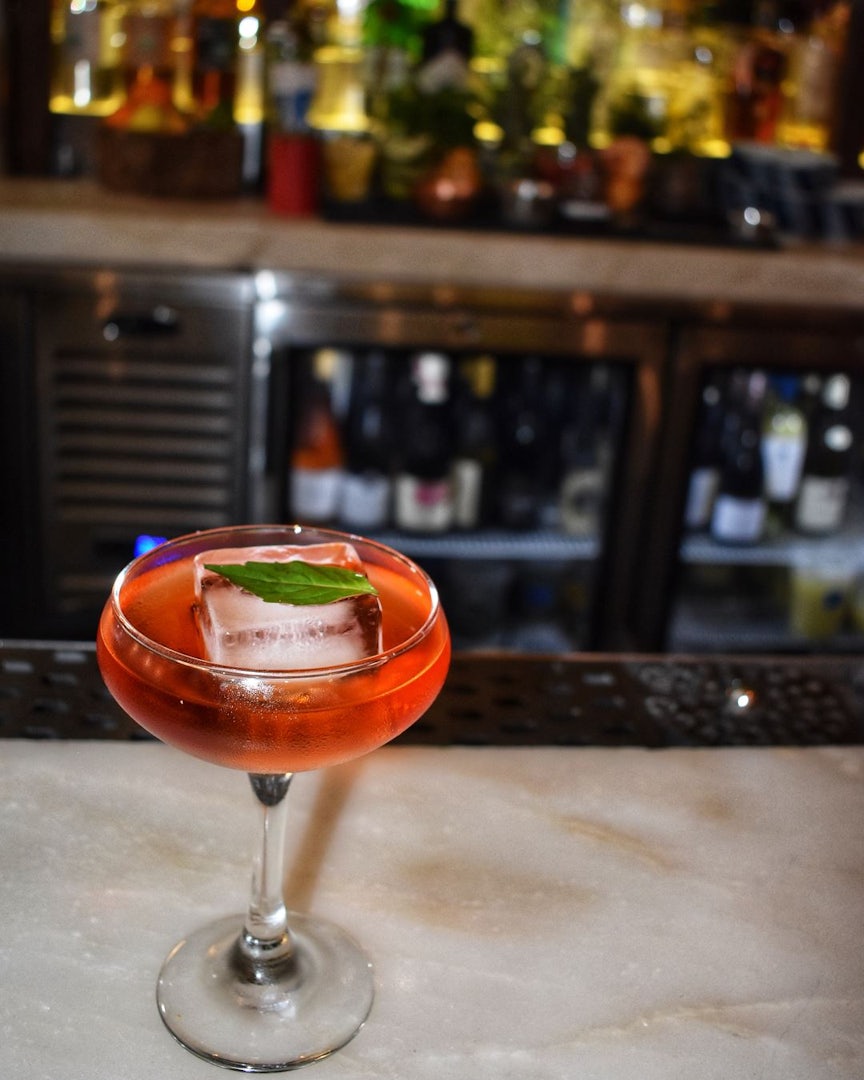 a red coloured cocktail at Kyu bar Miami