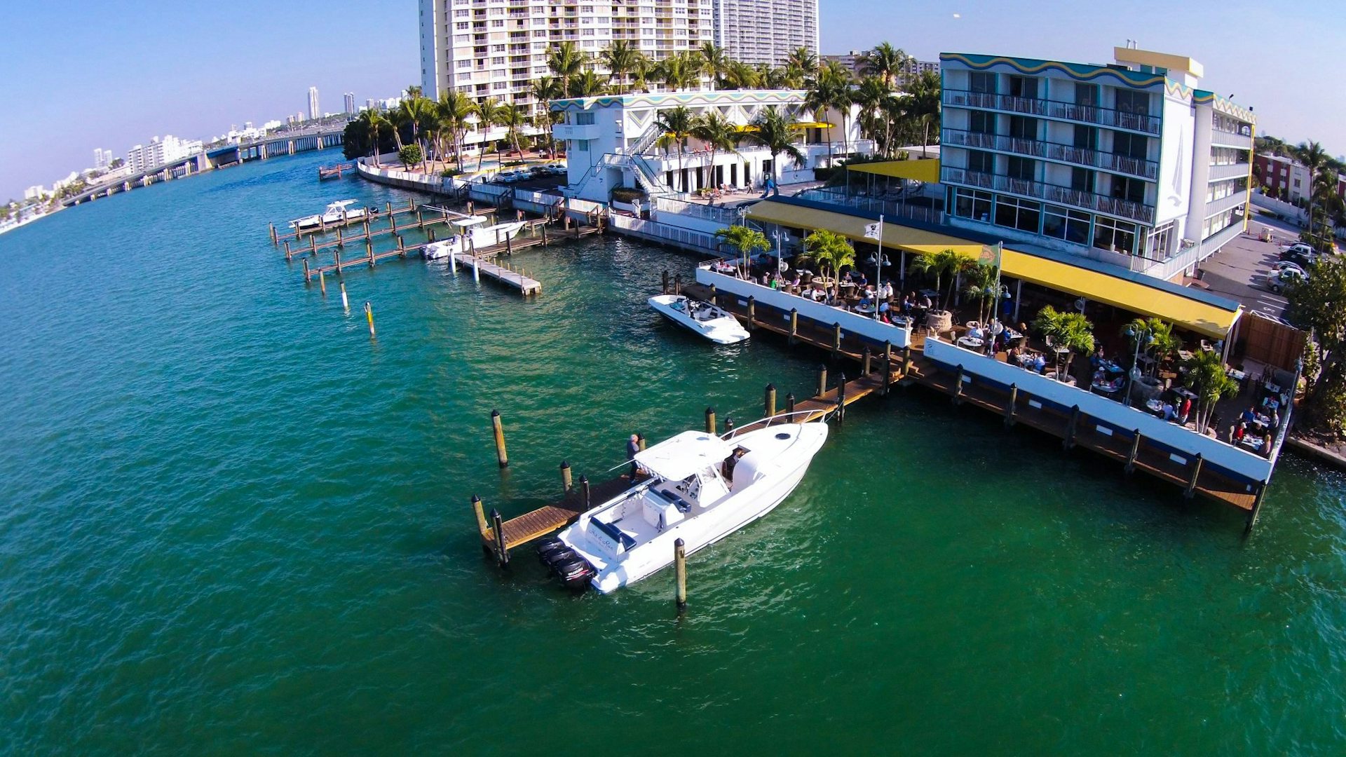 a boat docked at Shuckers Waterfront Grill