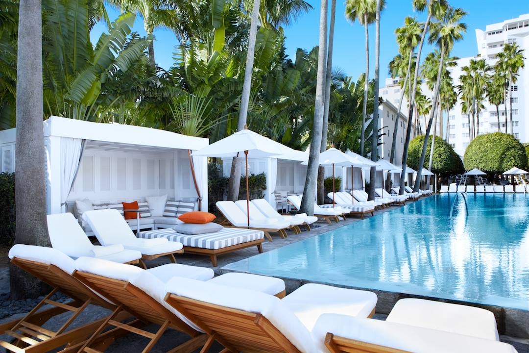swimming pool and white lounge chairs at the Delano South Beach
