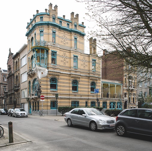 a corner building with a boat in the design