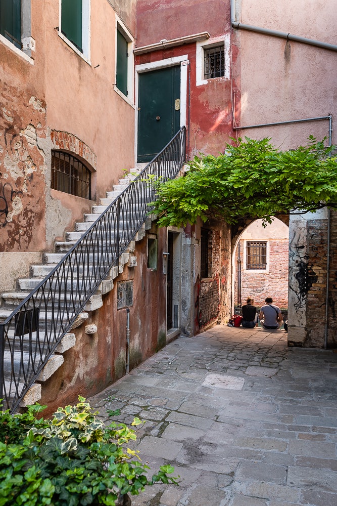 a couple sitting down at the Corte Della Comare