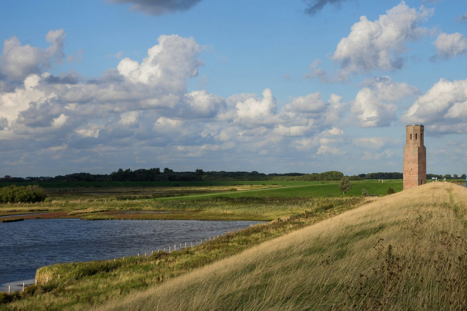 the Plompe Toren and view over green fields