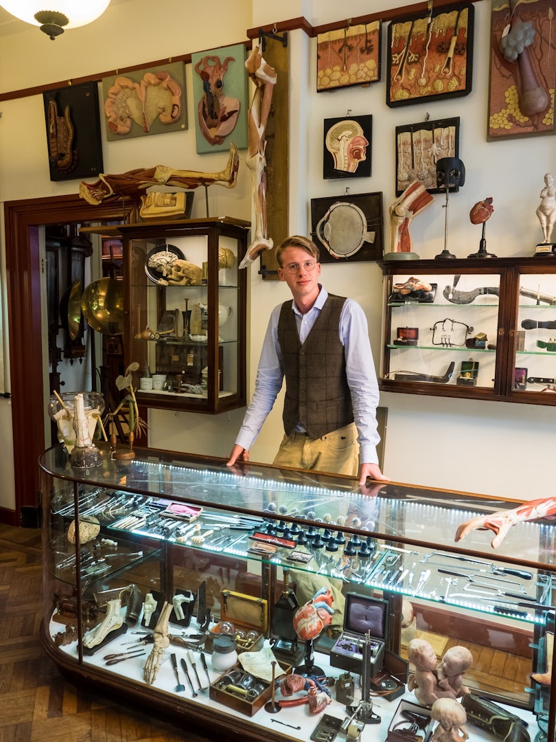 shop owner of Van Leest Antiques in the store