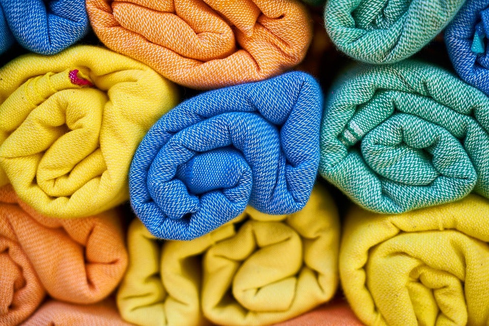 blue, orange, green and yellow textiles