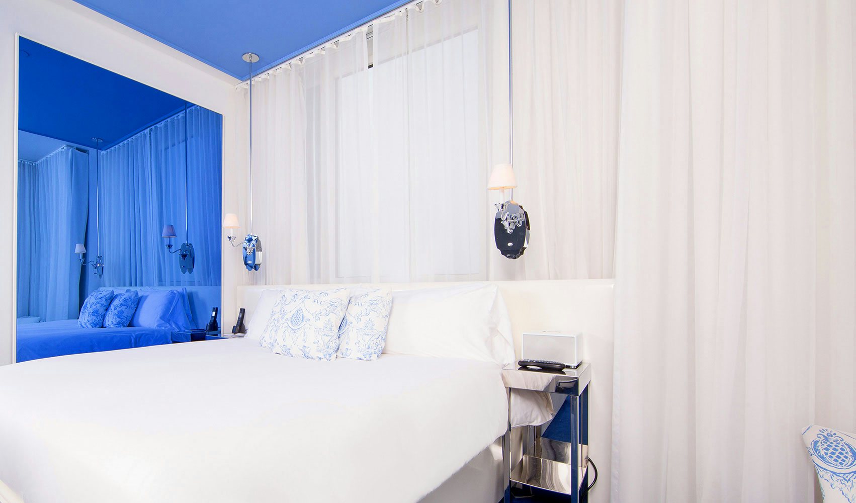 white and blue designed room at Nomo