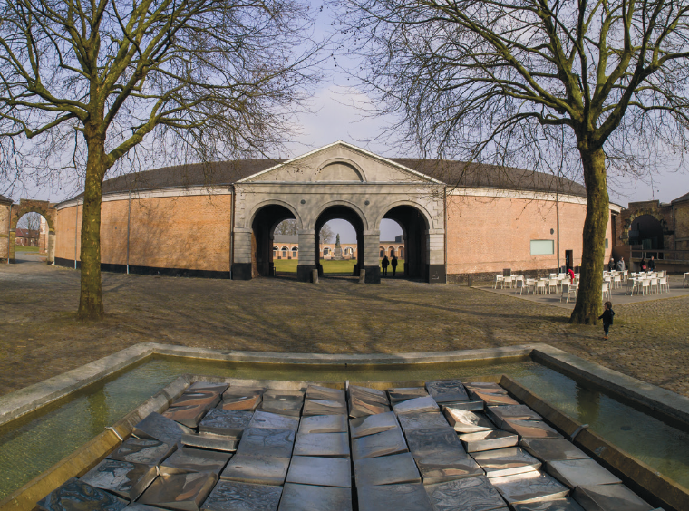 a fountain in front of Le Grand-Hornu