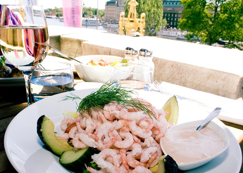 shrimp salad with avocado and a glass of white wine