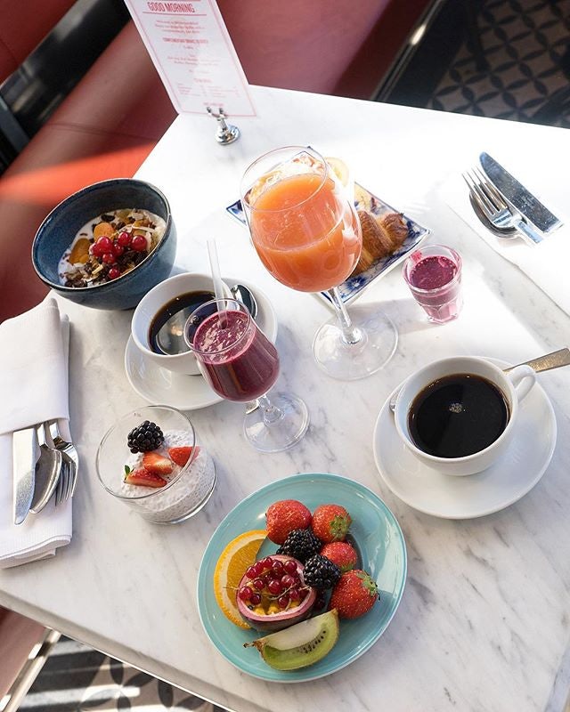 breakfast with fresh fruit, chia pudding, juices and coffee