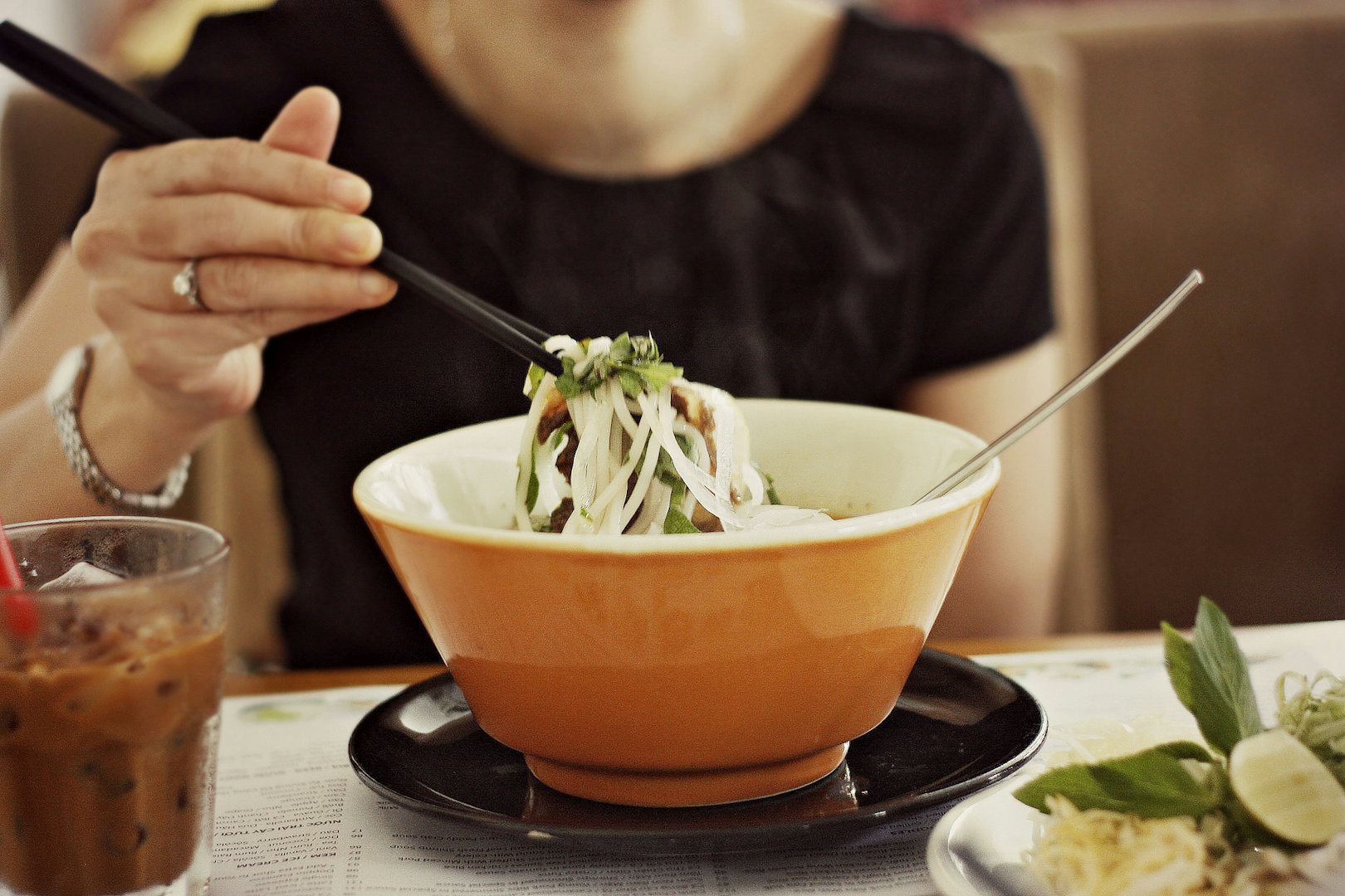 woman eating Bun Bo Hue