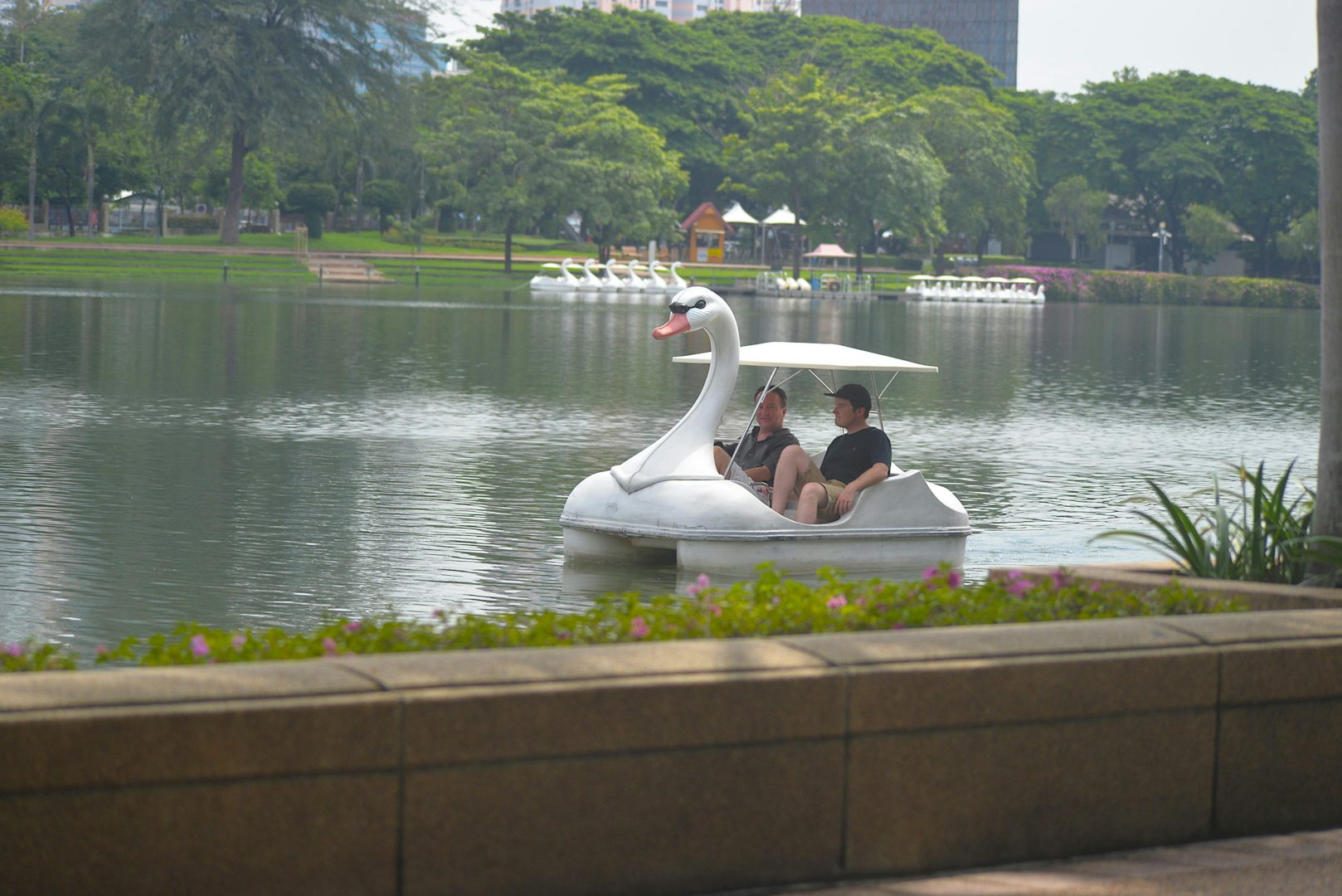 people paddling in Benjakitti Park