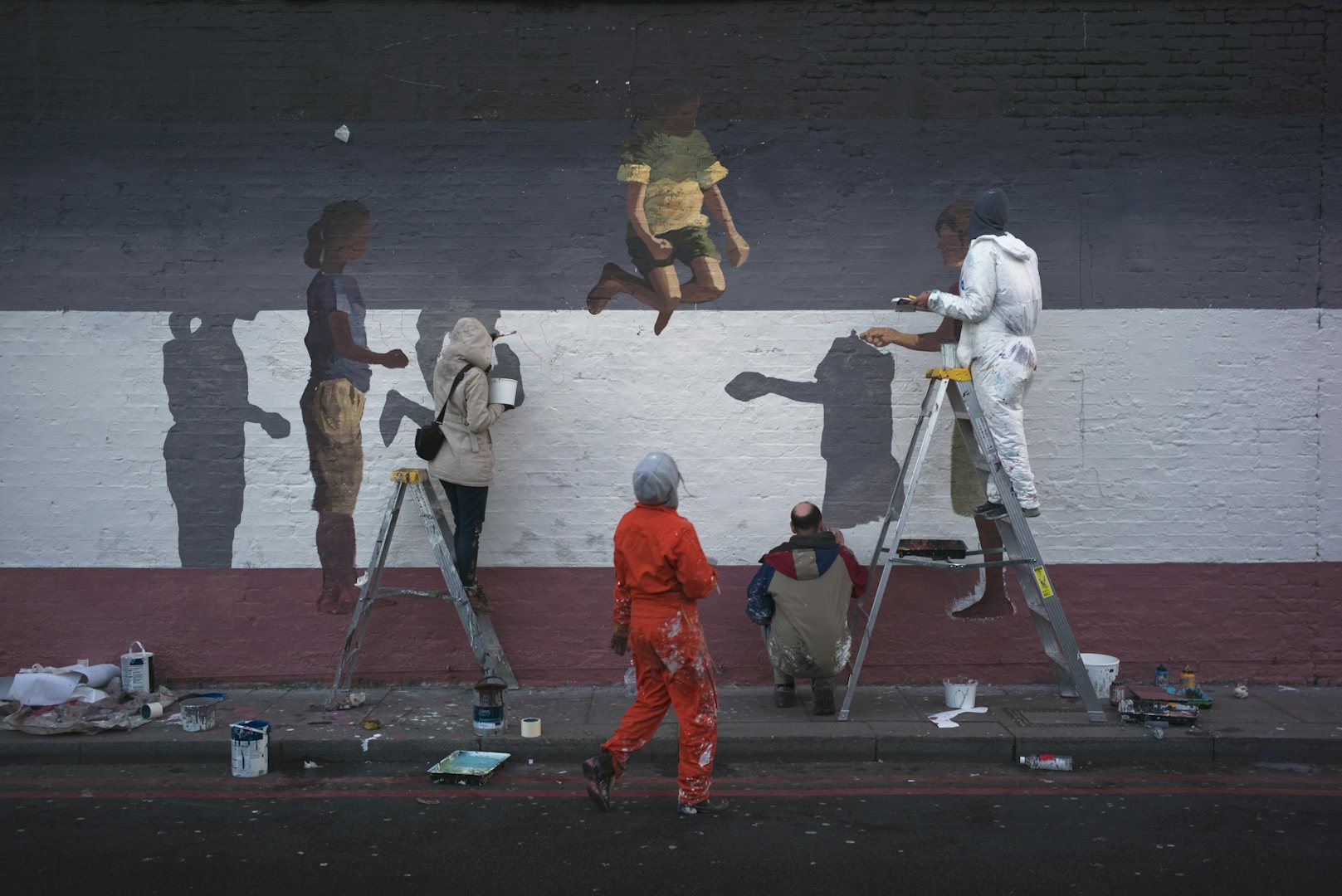 people painting a mural in Shoreditch