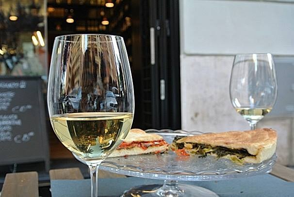 a glass of white wine at Bancovino