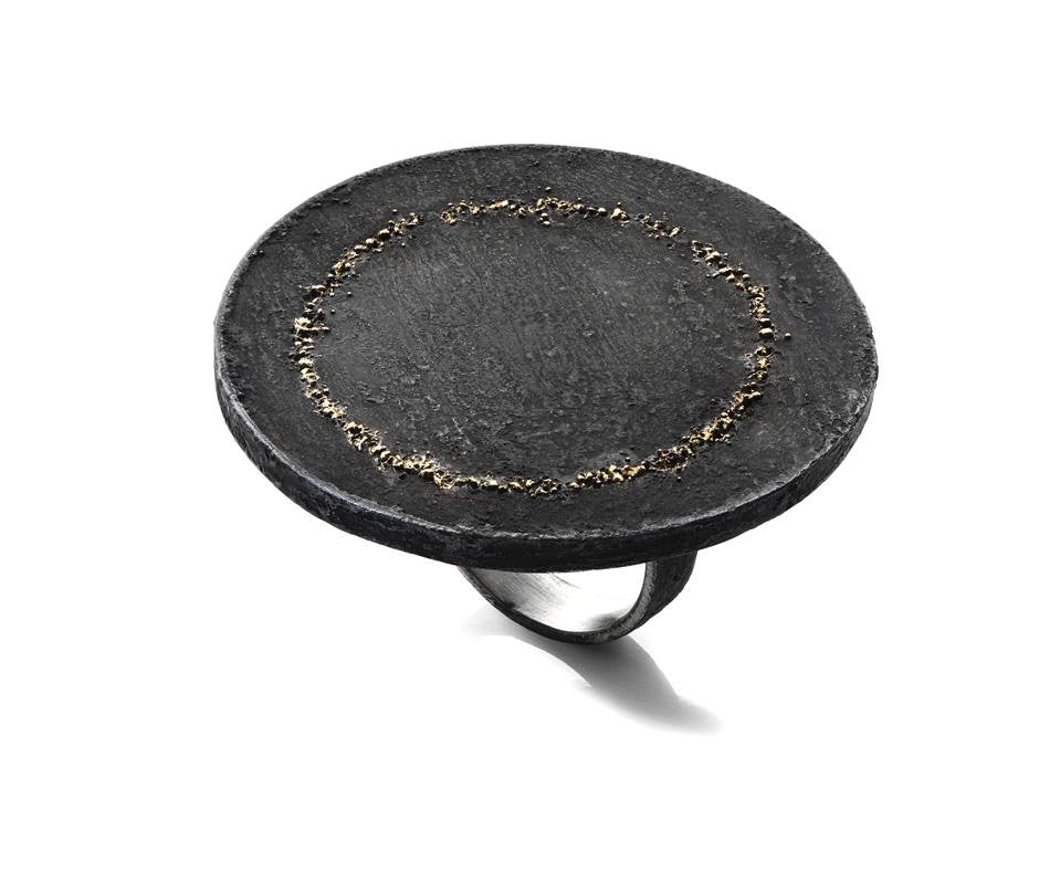 a black ring made of stone from alternatives gallery Rome