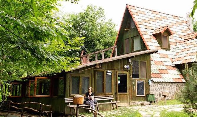 woman sitting outside at Hindiba Nature House