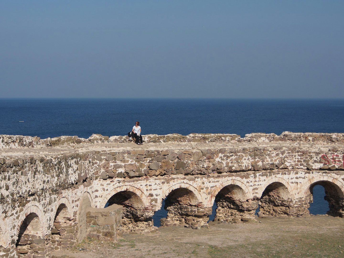 a woman on top of Rumeli Feneri Castle in Istanbul