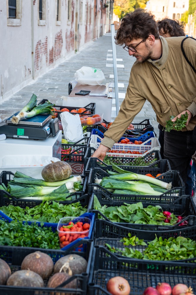 a man shopping for vegetables at the Orto delle Meraviglie