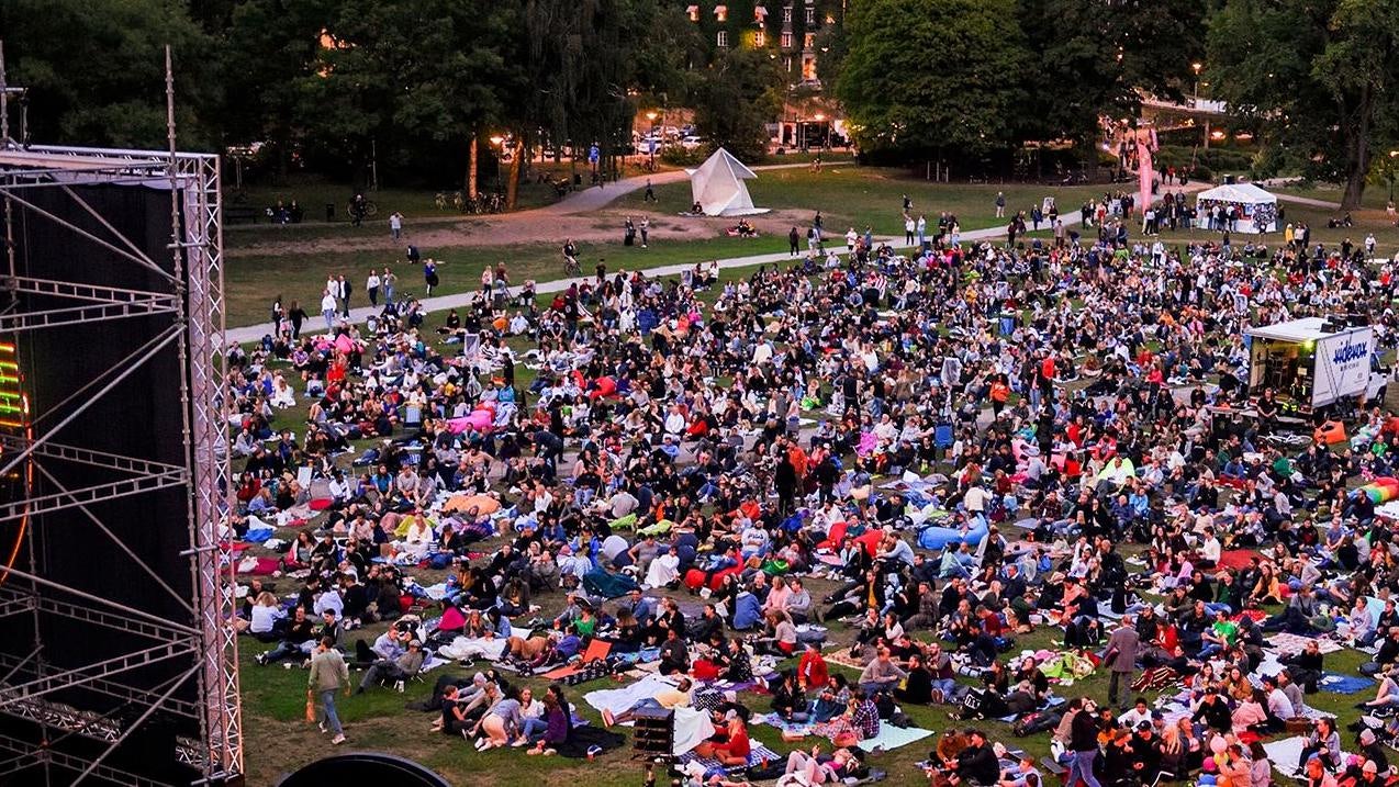 people watching a movie in a park