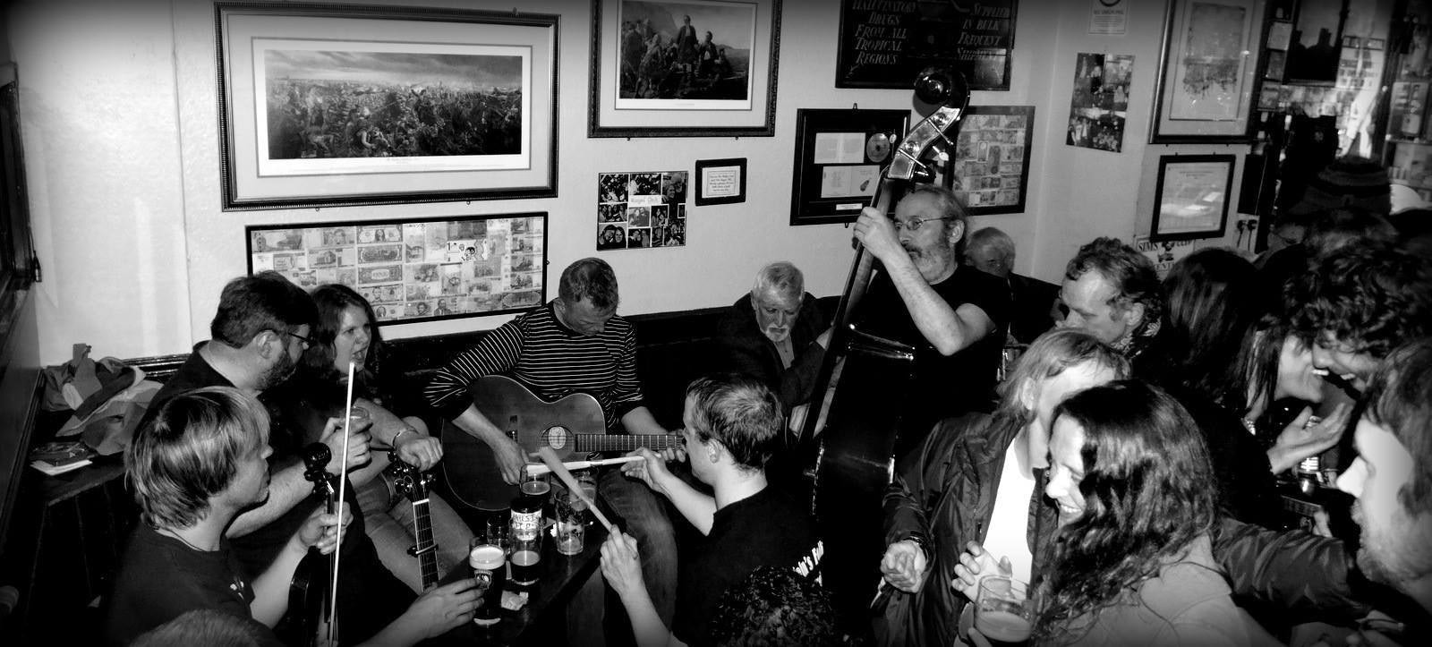 black and white picture of a folk band at The Royal Oak