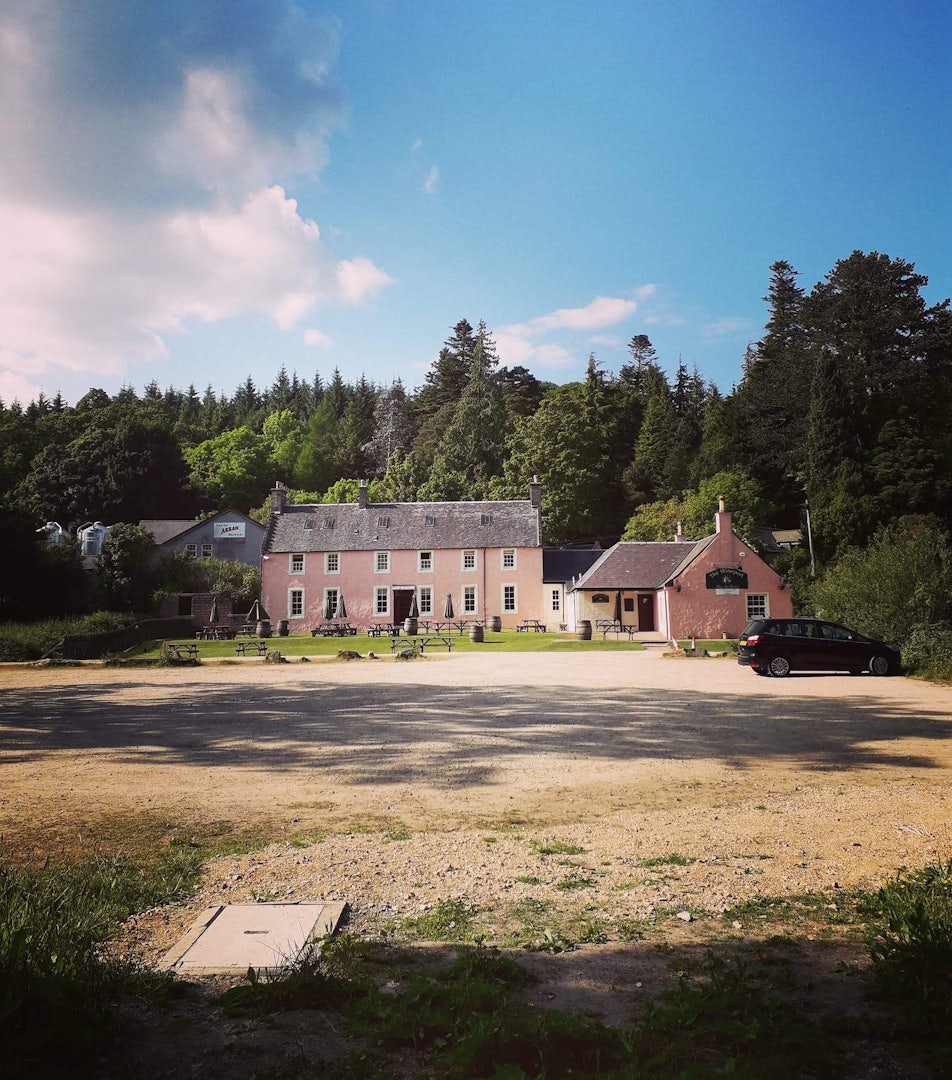 exterior of The Wineport surrounded by trees at the Isle of Arran