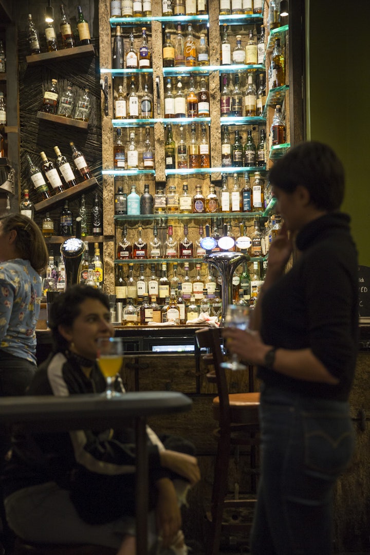 wall full with bottles of scotch at Ben Nevis bar