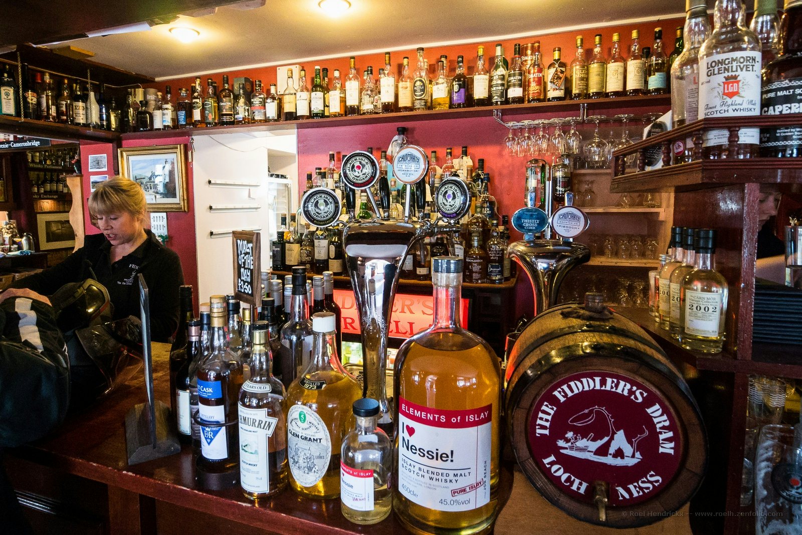 interior filled with bottles of Scotch at Fiddler's bar near Loch Ness