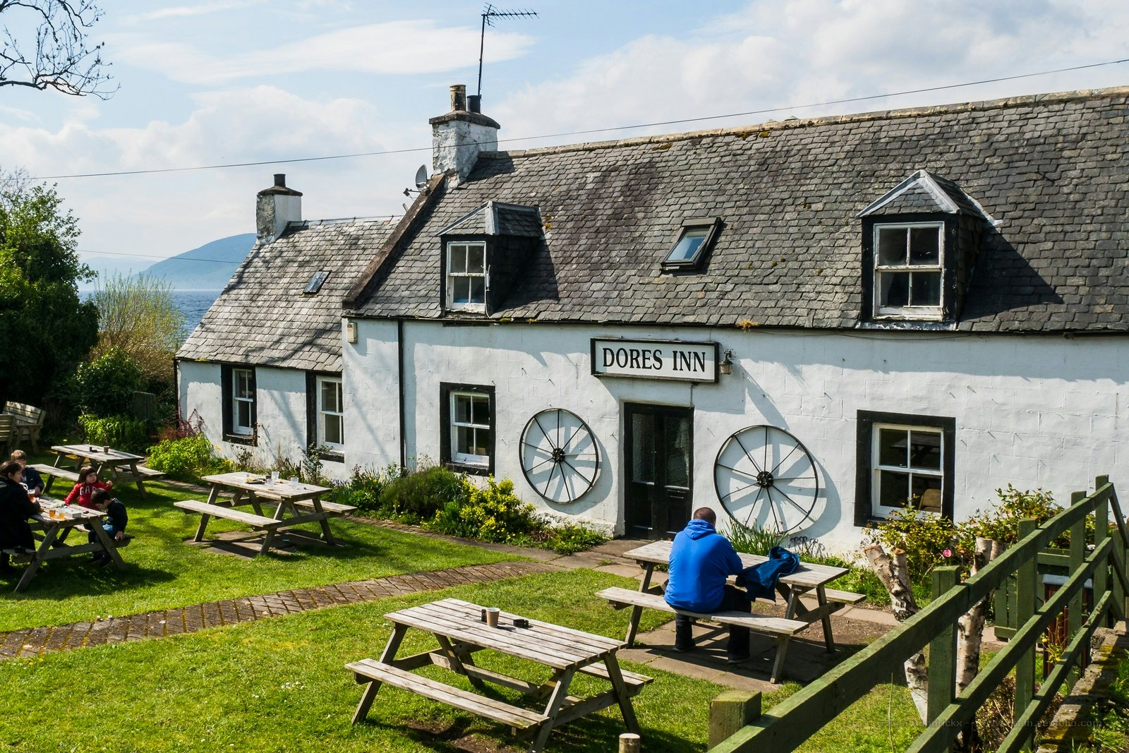 white exterior of Dores Inn cottage in Scotland