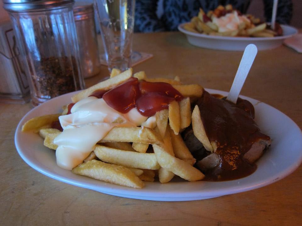 german sausage with fries and curry sauce