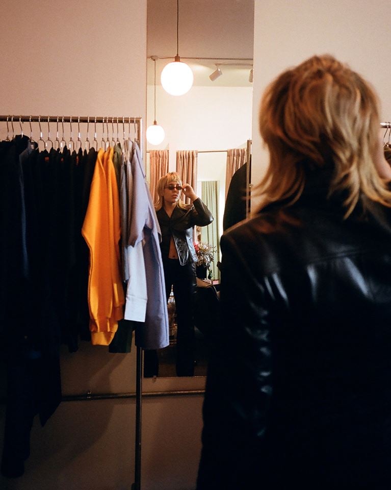 a woman fitting clothes at the Break NY