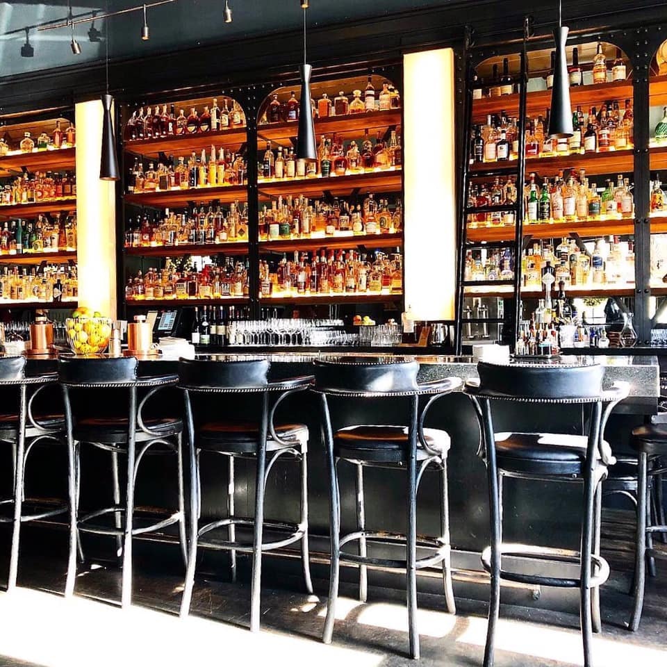 bar full with spirits at the Saratoga cocktail bar