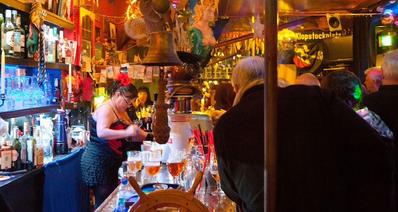 decoration and bar woman getting a beer at Zum Seeteufel bar