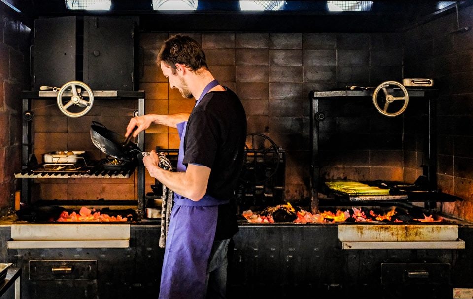 Chef from Fiskeskur grilling fish on the barbecue