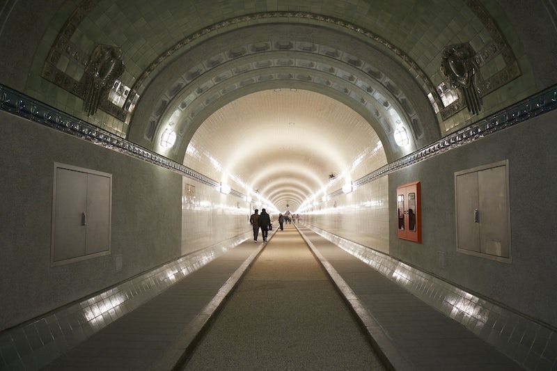 people walking through the old Elbtunnel in Hamburg